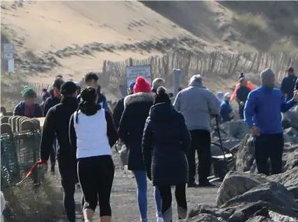  ??  ?? Busy walkway at Strandhill beach on Sunday. Pic: Carl Brennan.