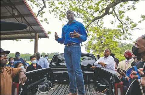  ?? (The Daily Times/Riley Bunch) ?? U.S. Sen. Raphael Warnock, R-Ga., speaks with Black farmers in Byromville, Ga.. Warnock addressed targeted federal relief in the American Rescue Plan for farmers of color and vowed to tackle the history of discrimina­tory practices by the U.S. Department of Agricultur­e.