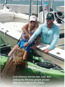  ??  ?? Lexis Chancey and her dad, Capt. Ben, hold up the first-ever goliath grouper that Lexis caught from a kayak.