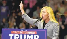  ?? Chris Carlson Associated Press ?? REP. MARJORIE Taylor Greene (R-Ga.) speaks at a recent Trump rally. Partisan primaries in safe districts tend to reward extremism.