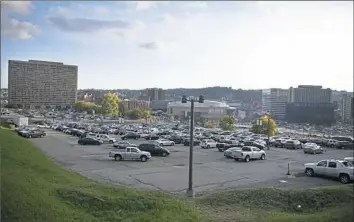  ?? Post-Gazette ?? In a 2017 photo, the site of the former Civic Arena is now a parking lot in Uptown. About 935 units of affordable housing are to be built on the site by the Penguins and their developer, McCormack Baron Salazar.