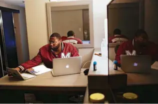  ?? Brynn Anderson / Associated Press ?? Morehouse senior Lanarion “LTL” Norwood Jr. works on his computer in a hotel room in Atlanta. Morehouse is a historical­ly Black college, and nearly 3 in 5 HBCU students are low-income.