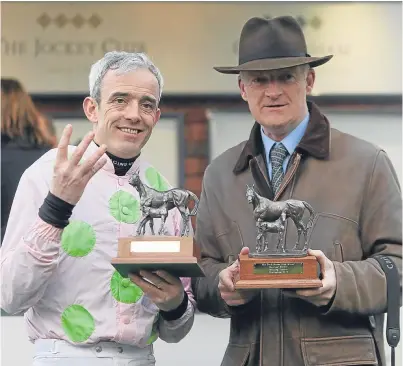  ?? Picture: PA. ?? Ruby Walsh and trainer Willie Mullins bagged four winners as the Irish dominated at the Cheltenham Festival yesterday.