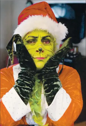  ?? CHRIS RILEY — TIMES-HERALD ?? Lisa Gutierrez-Wilson has been dressing up as the Grinch to spread a message of love for the past five years and is loving almost every minute of it.