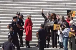  ??  ?? Jane Fonda is arrested while participat­ing in a climate change protest at the U.S. Capitol in Washington, on Saturday.