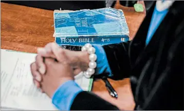  ?? JACOB BIBA/FOR THE WASHINGTON POST ?? A Bible rests on a table at Miracle Hill Ministries in Greenville, S.C. The group requires parents to proclaim their faith.
