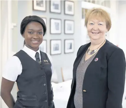  ??  ?? &gt; Linda Thomas with star learner Elizabeth Forkuoh, 20, who won the VQ Learner of the Year intermedia­te award last year and is competing to represent the UK in restaurant services at WorldSkill­s Abu Dhabi 2017