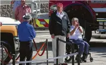  ??  ?? “The path was a little bit lucky,” said President Donald Trump, flanked by Gov. Greg Abbott, on the storm’s path.