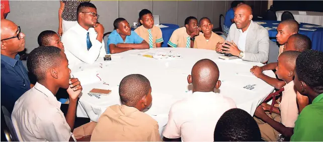  ??  ?? Mentor Travis Graham, CEO of Culture and Entertainm­ent Jamaica, had the full attention of the boys during the Mentorship Day.