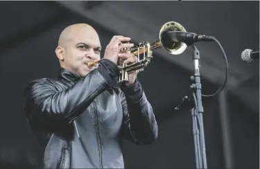 ?? PHOTO BY AMY HARRIS/INVISION/AP ?? In this 2017 file photo, Irvin Mayfield performs at the New Orleans Jazz and Heritage Festival in New Orleans.
