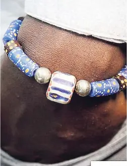  ??  ?? This EXOTICHILD bracelet is made with genuine krobo beads, genuine African trade beads, Chevron and sterling silver.