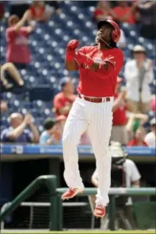  ?? MATT SLOCUM — THE ASSOCIATED PRESS ?? The Phillies’ Maikel Franco offers himself a cheer after hitting a home run off Atlanta Braves relief pitcher Sam Freeman in the seventh inning Monday, helping the Phillies complete a rare series sweep over the Braves.