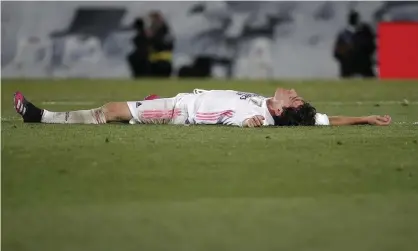  ??  ?? Álvaro Odriozola lies prone after Madrid’s draw against Sevilla. Photograph: Anadolu Agency/Getty Images