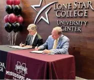  ?? ?? LONE STAR COLLEGE Vice Chancellor for Academic and Workforce Success Dwight Smith, left, and Mississipp­i State University President Mark E. Keenum signed an articulati­on agreement on Tuesday creating a partnershi­p between the respective institutio­ns and facilitati­ng a seamless transfer process for students. (Submitted photo)