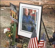  ?? John Locher Associated Press ?? A PHOTO of Stoke and keepsakes grace a makeshift roadside memorial last weekend in Redding.