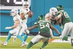  ?? Charles Trainor Jr. / Miami Herald / TNS ?? The only NFL experience Miami quarterbac­k Tua Tagovailoa has gotten came in the waning moments against the Jets on Oct. 18.