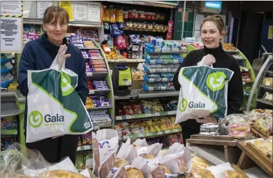  ?? Photo by Domnick Walsh ?? Noreen Barry and Joanne O’Sullivan, In Holly’s Gala, getting the groceries ready for home delivery to vulnerable locals in Moyvane last week.