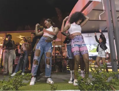  ?? ?? GOOD VIBES. Women dance to the jazzy, soulful beat in a nightclub during an amapiano party in Johannesbu­rg last month.