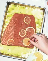  ?? MICHAEL GRAYDON ?? Slow Salmon with Citrus and Herb Salad, with wild salmon, also can be made with halibut or cod.