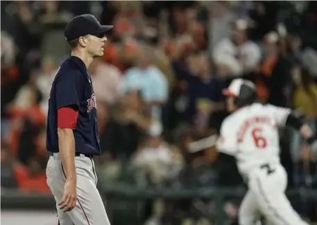  ?? AP ?? FALLING FAST: Red Sox starter Nick Pivetta looks on as Baltimore’s Ryan Mountcastl­e rounds the bases after hitting a three-run homer during the third inning Thursday night in Baltimore.