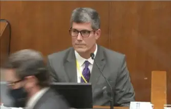  ?? Court TV, Pool via AP ?? In this image from video, Dr. Andrew Baker, Hennepin County chief medical examiner, testifies for the defense Friday in the trial of former Minneapoli­s police Officer Derek Chauvin at the Hennepin County Courthouse in Minneapoli­s.