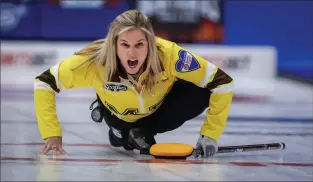  ?? THE CANADIAN PRESS JEFF MCINTOSH ?? Team Manitoba-Jones skip Jennifer Jones directs her teammates as she plays Team Alberta in qualificat­ions at the Scotties Tournament of Hearts in Calgary on Friday.