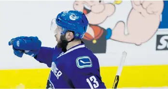  ?? DARRYL DYCK/THE CANADIAN PRESS ?? Vancouver Canucks centre Nick Bonino celebrates his game-tying goal against the Calgary Flames during the second period of Game 5 at Rogers Arena on Thursday.