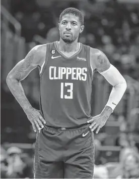  ?? Ringo H.W. Chiu/associated Press ?? Clippers All-star Paul George sprained his right knee when he collided with Oklahoma City’s Luguentz Dort late in Tuesday’s 101-100 loss to the Thunder.