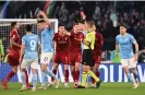  ?? Photograph: Alberto Lingria/Reuters ?? Roma's Roger Ibañez is shown a red card by referee Davide Massa.