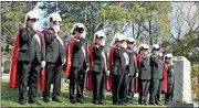  ?? Doug Walker / RN-T ?? Local Knights of Columbus salute during the singing of the national anthem during the Veterans Day service at Myrtle Hill.