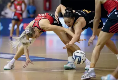  ??  ?? Tactix defender and captain Jane Watson battles for possession with Magic shooter Abigail Latu-Meafou during the ANZ premiershi­p match in Auckland last night. The Tactix won 45-36, their second victory in four games, leaving the Magic with one win from three matches.