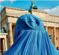  ?? AFP ?? Germany’s new law on facial coverings falls short of a total ban in public places demanded by right-wing parties. —