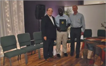  ?? LUCAS RODGERS - DIGITAL FIRST MEDIA ?? State Sen. Andy Dinniman, from left, presents a Senate proclamati­on to Parkesburg Point Executive Director Dwayne Walton and Board President Dr. James Holt, during a celebratio­n for the youth center’s 15th anniversar­y on Thursday evening.