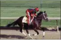  ?? GARRY JONES — THE ASSOCIATED PRESS ?? Kentucky Derby hopeful Classic Empire, ridden by exercise rider Martin Rivera, gallops at Churchill Downs in Louisville, Ky., on Monday.