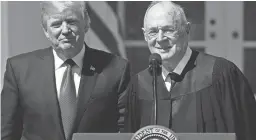  ?? AP ?? President Donald Trump, left, and Supreme Court Justice Anthony Kennedy participat­e in a public swearing-in ceremony for Justice Neil Gorsuch in the Rose Garden of the White House on April 10, 2017.