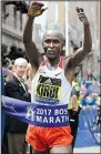  ?? AP/ELISE AMENDOLA ?? Geoffrey Kirui held off United States Olympian Galen Rupp over the final 2 miles to become the first Kenyan to win the men’s division since 2012.