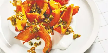  ?? TOM McCORKLE/THE WASHINGTON POST ?? This roasted squash with yogurt is hot, sweet, salty and sour all at once — and that’s a beautiful thing.