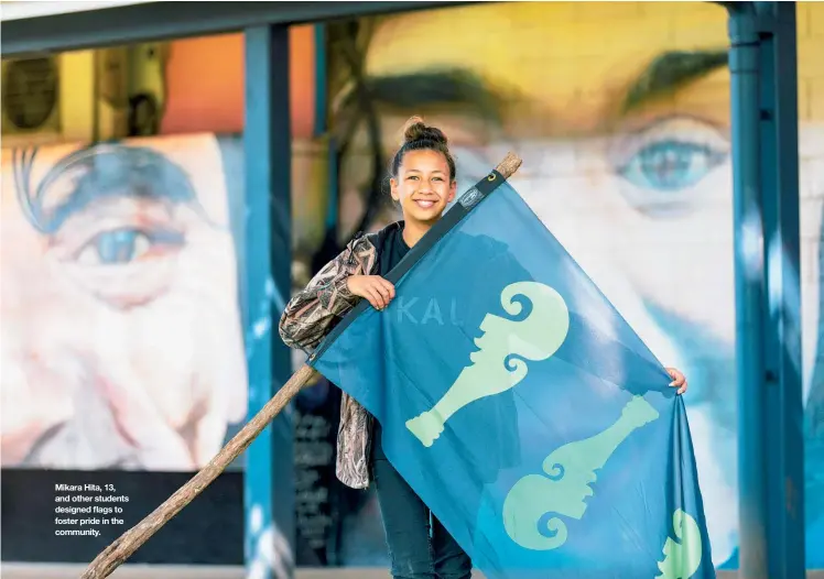  ??  ?? Mikara Hita, 13, and other students designed flags to foster pride in the community.