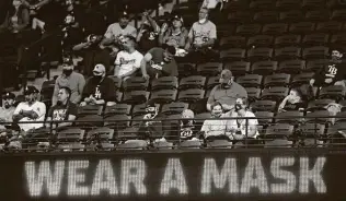  ?? Ronald Martinez / Getty Images ?? The same kind of social distancing that was in effect for the 2020 World Series at Globe Life Field in Arlington would be used for Astros games beginning in April.