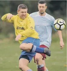  ??  ?? Wearmouth CW Old Boys (blue) battle Pennywell Comrades Over-40s.