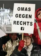  ?? Images ?? A woman holds a placard which reads ‘Grannies against the right’ during a rally in Vienna on Friday. Photograph: Tobias Steinmaure­r/APA/AFP/Getty