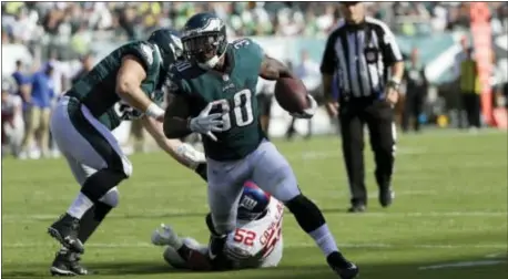  ?? MICHAEL PEREZ — THE ASSOCIATED PRESS ?? Eagles running back Corey Clement, here scoring a touchdown against the Giants last Sunday, is looking to impress Wisconsin college mate Melvin Gordon this week when the Birds travel to California to play the Chargers. his