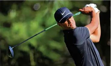  ?? CURTIS COMPTON / CCOMPTON@AJC.COM ?? Tony Finau makes his tee shot Thursday during the first round of the Masters at Augusta National Golf Club. Finau shot a 68 on the day, and is in second place behind Jordan Spieth.