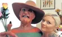  ??  ?? Polly with her life-sized Freddy Krueger model