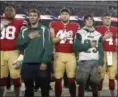  ?? TONY AVELAR — ASSOCIATED PRESS ?? 49ers players stand with students from Paradise High School during the national anthem before a game against the Giants on Nov. 12.