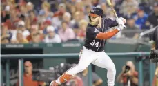  ?? NICK WASS/AP ?? Harper bats during a Sept. 21 game against the New York Mets in Washington. .