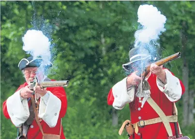  ?? Picture: Kris Miller. ?? A re-enactment of events at Killiecran­kie. A group fighting plans to dual the A9 over the battlefiel­d is now demanding the National Trust for Scotland breaks its silence on the issue.