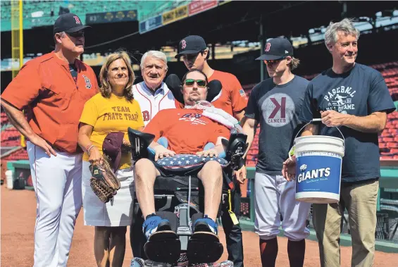  ?? PHOTO COURTESY BOSTON RED SOX ?? ALL TOGETHER: Red Sox manager John Farrell (left) and utility player Brock Holt (second from right) joined Pete Frates and his mother Nancy, grandfathe­r Gerry D’Alfonso, brother Andrew and father John at Fenway Park on Saturday.