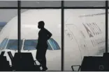  ?? CHARLIE RIEDEL/AP FILE ?? Delta Air Lines had to cancel about 100 flights on Sunday because of staff shortages, but it opened middle seats on some flights to accommodat­e passengers.