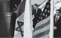  ?? Jacquelyn Martin / Associated Press ?? Secretary of State Antony Blinken, center, is greeted by Gil Haskel, Israel’s chief of state protocol, Saturday in Tel Aviv.